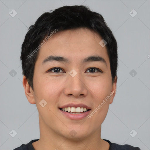 Joyful asian young-adult male with short  black hair and brown eyes