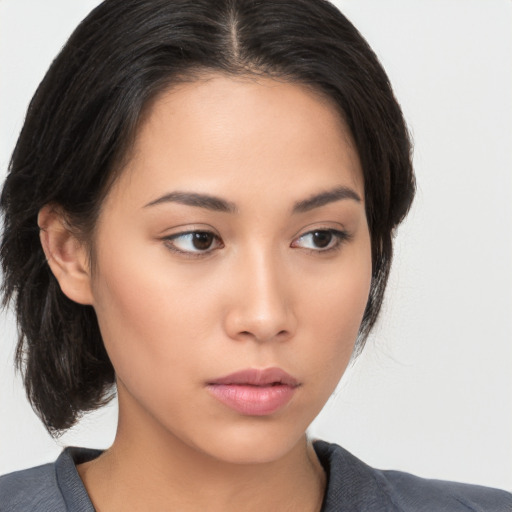 Neutral asian young-adult female with medium  brown hair and brown eyes