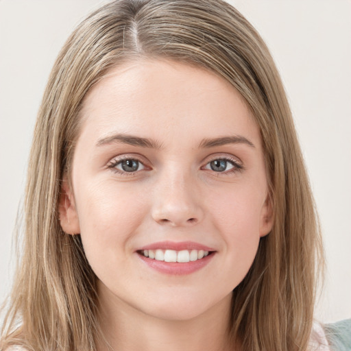 Joyful white young-adult female with long  brown hair and grey eyes