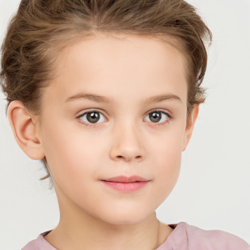 Joyful white child female with short  brown hair and brown eyes