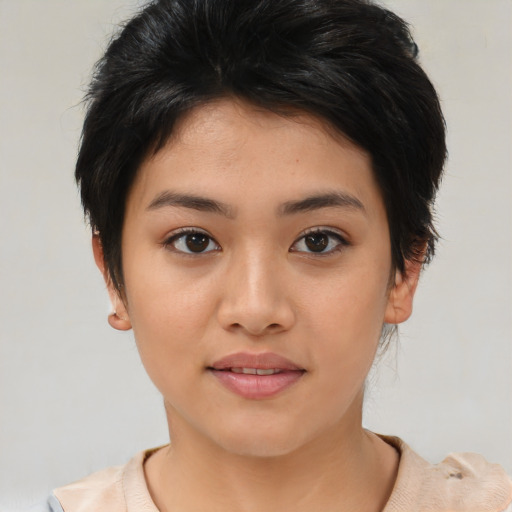 Joyful asian young-adult female with short  brown hair and brown eyes