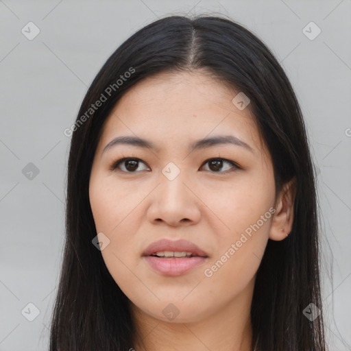 Joyful asian young-adult female with long  brown hair and brown eyes