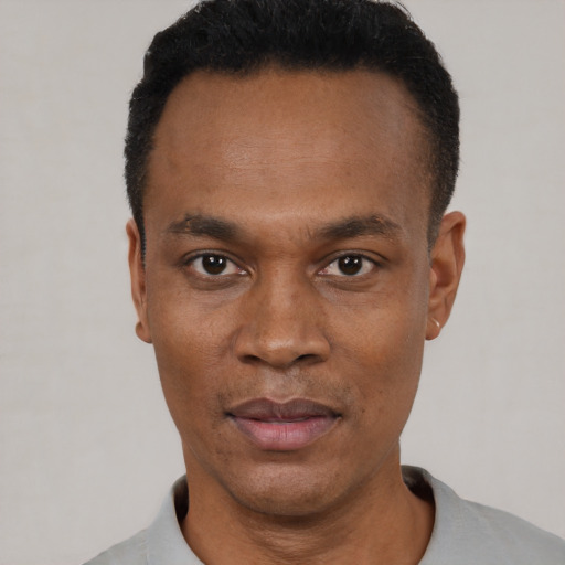 Neutral black young-adult male with short  black hair and brown eyes