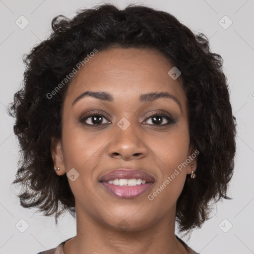 Joyful black young-adult female with long  brown hair and brown eyes