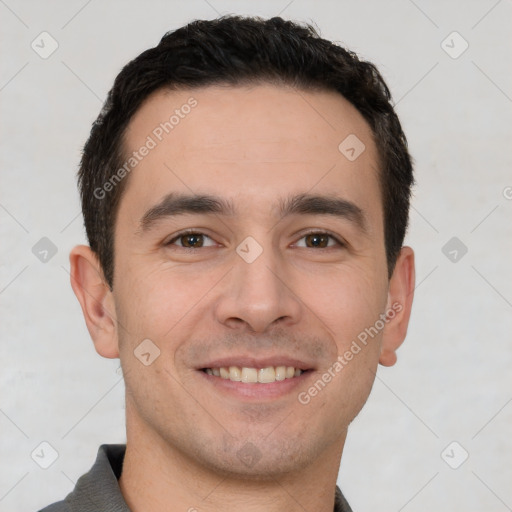 Joyful white young-adult male with short  brown hair and brown eyes