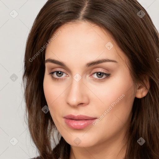 Neutral white young-adult female with long  brown hair and brown eyes