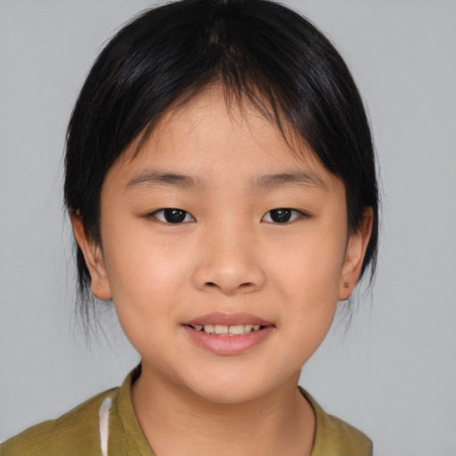 Joyful asian child female with medium  brown hair and brown eyes