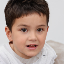 Joyful white child male with short  brown hair and brown eyes