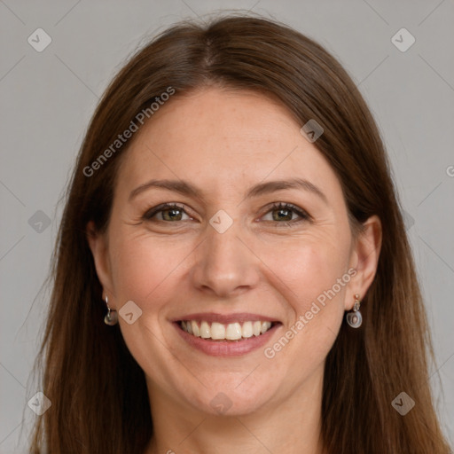 Joyful white adult female with long  brown hair and grey eyes