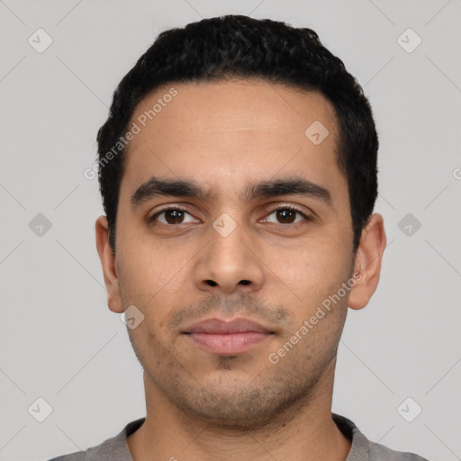 Neutral latino young-adult male with short  black hair and brown eyes