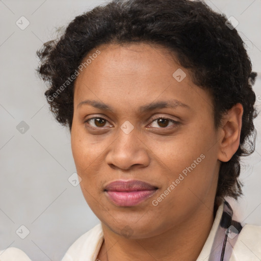 Joyful black adult female with short  brown hair and brown eyes