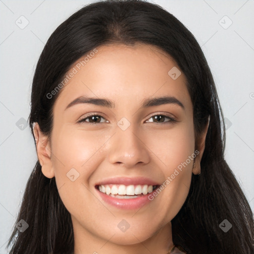 Joyful white young-adult female with long  brown hair and brown eyes