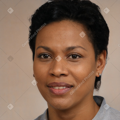 Joyful black young-adult female with short  black hair and brown eyes