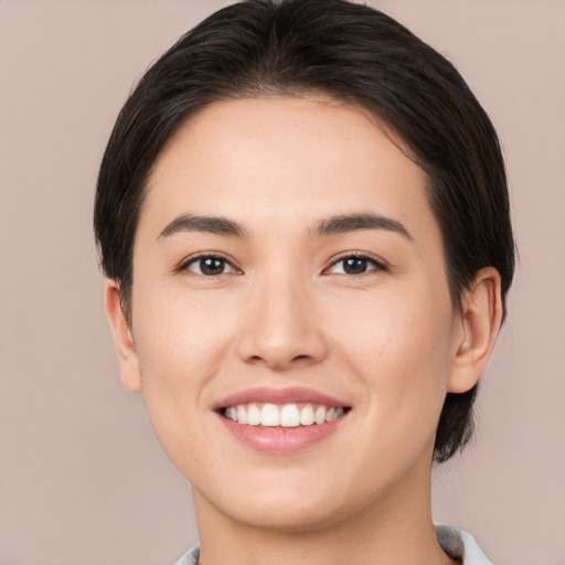 Joyful white young-adult female with medium  brown hair and brown eyes