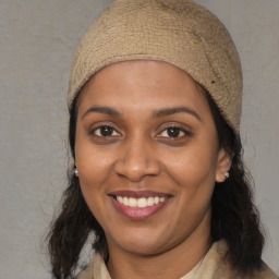 Joyful black young-adult female with medium  brown hair and brown eyes