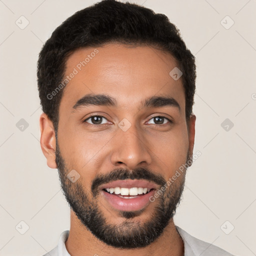 Joyful latino young-adult male with short  black hair and brown eyes