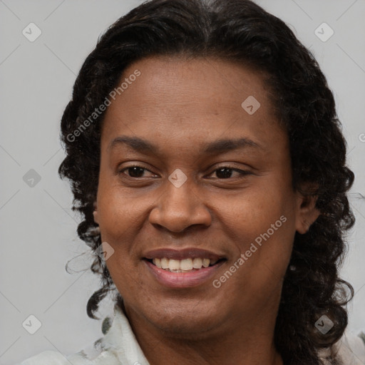 Joyful latino adult female with medium  brown hair and brown eyes