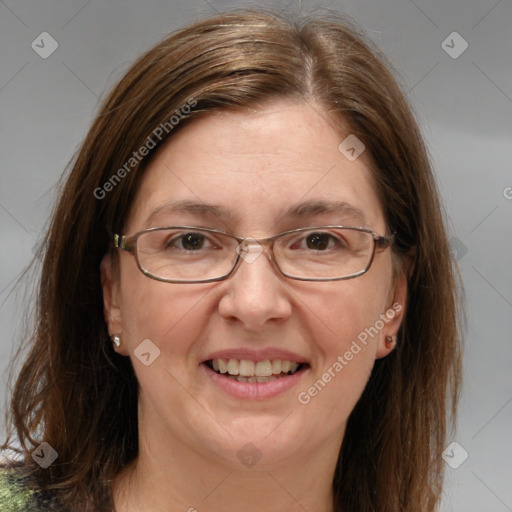 Joyful white adult female with medium  brown hair and grey eyes