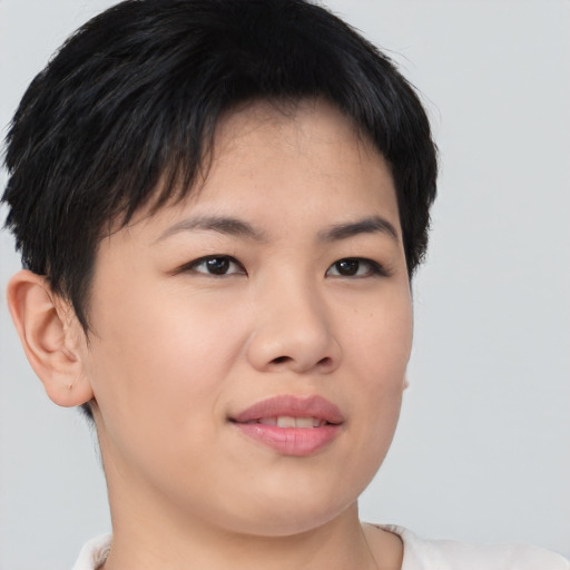 Joyful asian young-adult female with short  brown hair and brown eyes