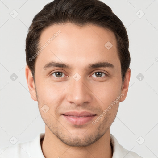 Joyful white young-adult male with short  brown hair and brown eyes