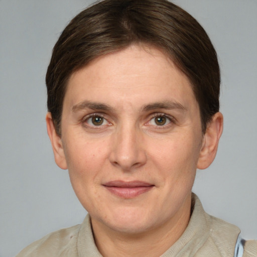 Joyful white adult female with short  brown hair and grey eyes