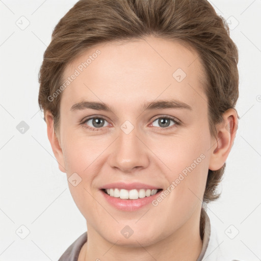 Joyful white young-adult female with short  brown hair and grey eyes