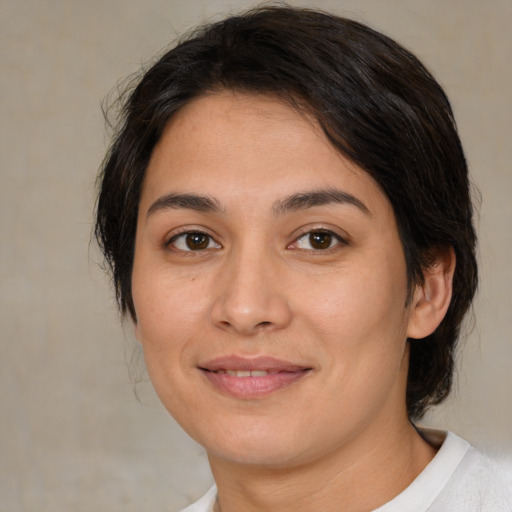 Joyful white young-adult female with medium  brown hair and brown eyes