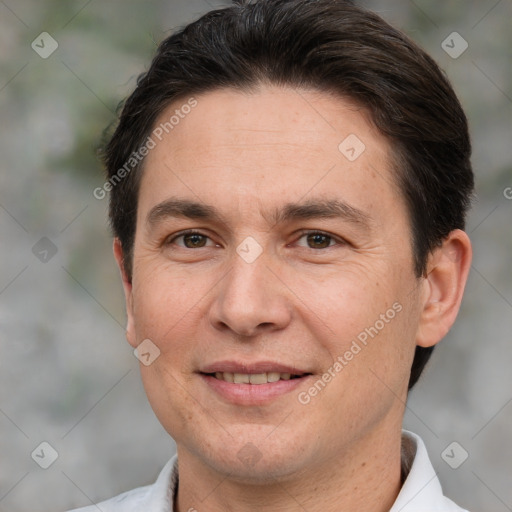 Joyful white adult male with short  brown hair and brown eyes