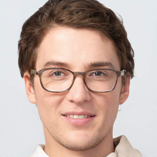 Joyful white adult male with short  brown hair and grey eyes