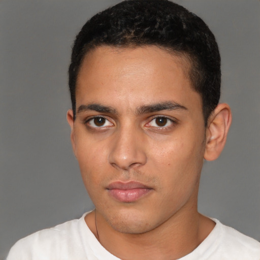 Neutral latino young-adult male with short  black hair and brown eyes