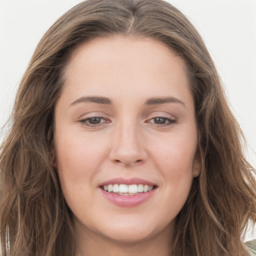 Joyful white young-adult female with long  brown hair and grey eyes