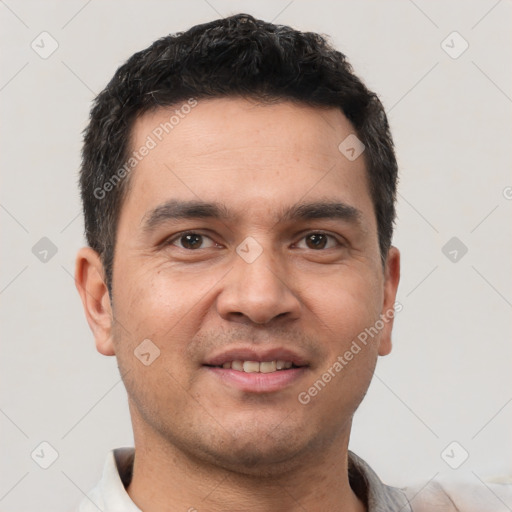 Joyful white young-adult male with short  black hair and brown eyes