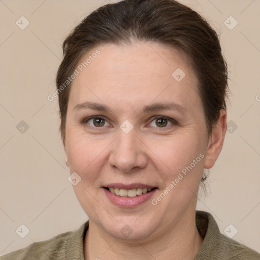 Joyful white adult female with short  brown hair and grey eyes