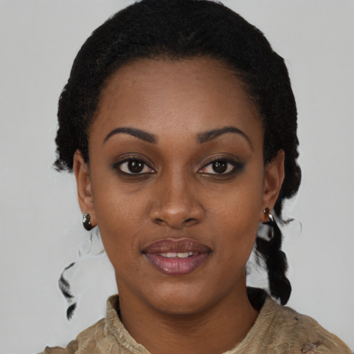 Joyful black young-adult female with medium  black hair and brown eyes