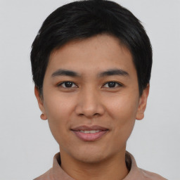 Joyful asian young-adult male with short  black hair and brown eyes