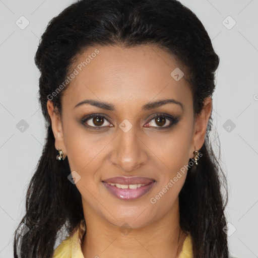 Joyful black young-adult female with long  brown hair and brown eyes