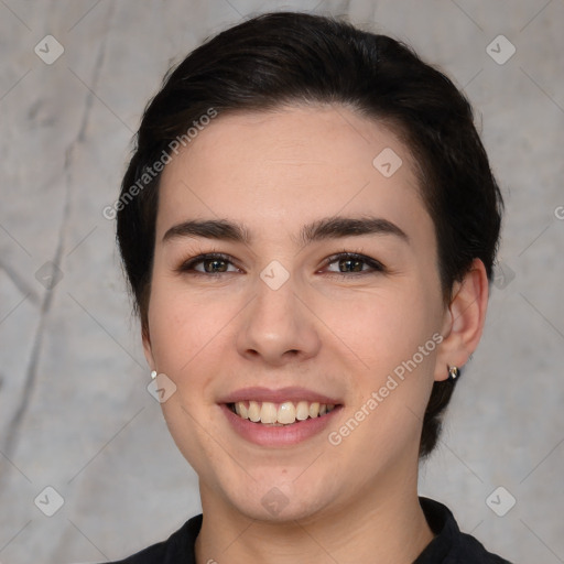 Joyful white young-adult female with medium  brown hair and brown eyes