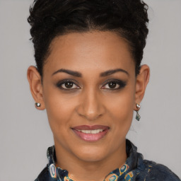 Joyful black young-adult female with short  brown hair and brown eyes