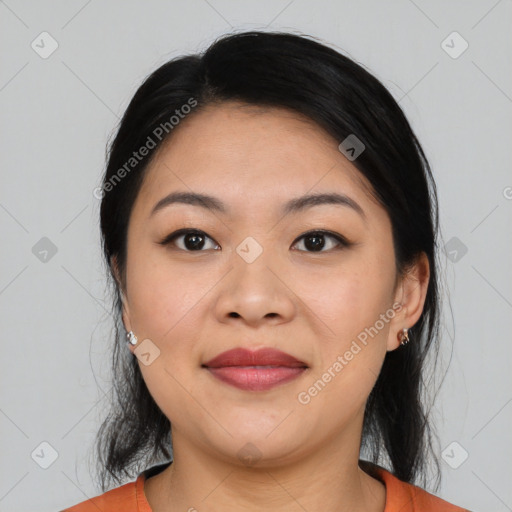 Joyful asian young-adult female with medium  black hair and brown eyes