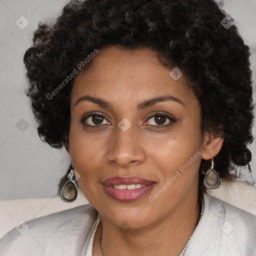 Joyful black young-adult female with long  brown hair and brown eyes