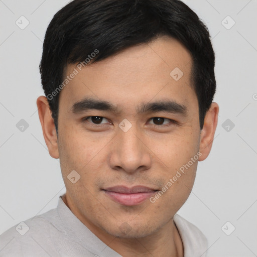 Joyful asian young-adult male with short  black hair and brown eyes