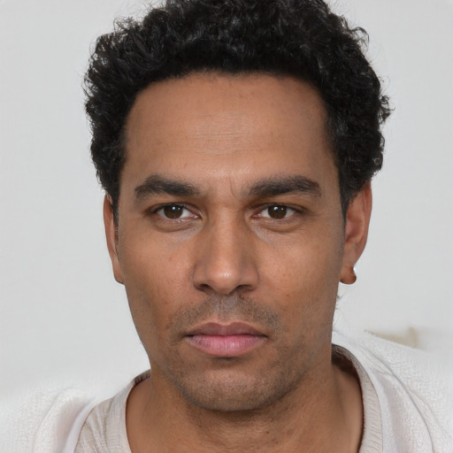 Neutral white young-adult male with short  black hair and brown eyes