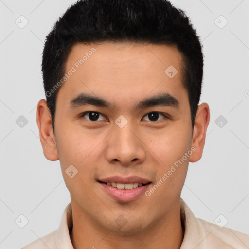 Joyful latino young-adult male with short  brown hair and brown eyes