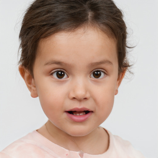 Joyful white child female with short  brown hair and brown eyes