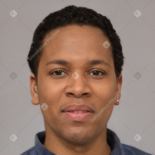 Joyful latino young-adult male with short  brown hair and brown eyes