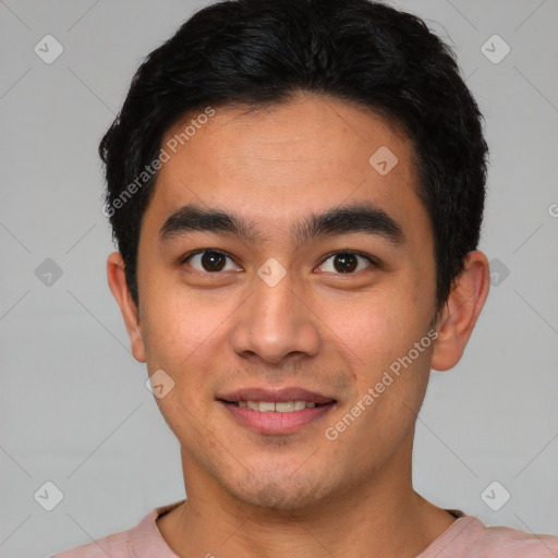 Joyful latino young-adult male with short  brown hair and brown eyes