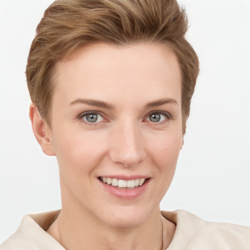 Joyful white young-adult female with short  brown hair and grey eyes