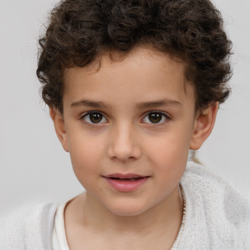 Joyful white child male with short  brown hair and brown eyes