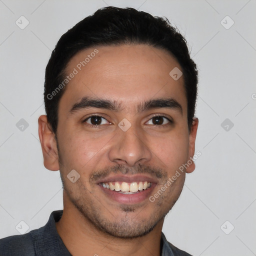 Joyful latino young-adult male with short  black hair and brown eyes