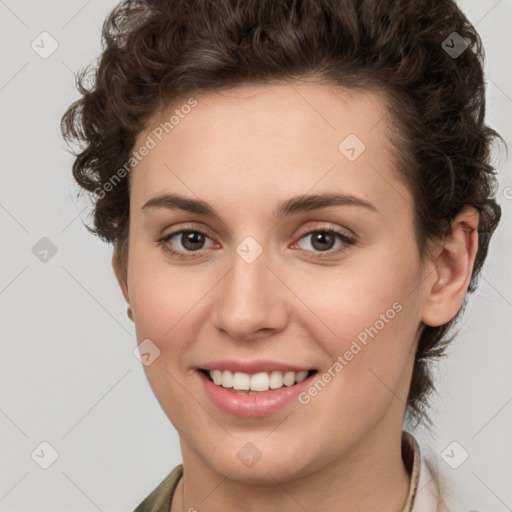 Joyful white young-adult female with medium  brown hair and green eyes